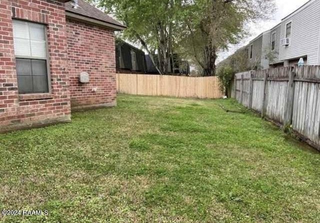 147 Oakbend Dr, Lafayette, LA 70506 - view of yard with a fenced backyard