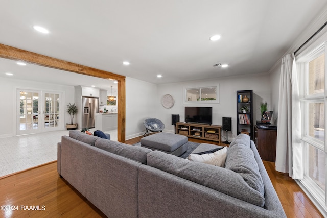 living room featuring wood-type flooring and french doors