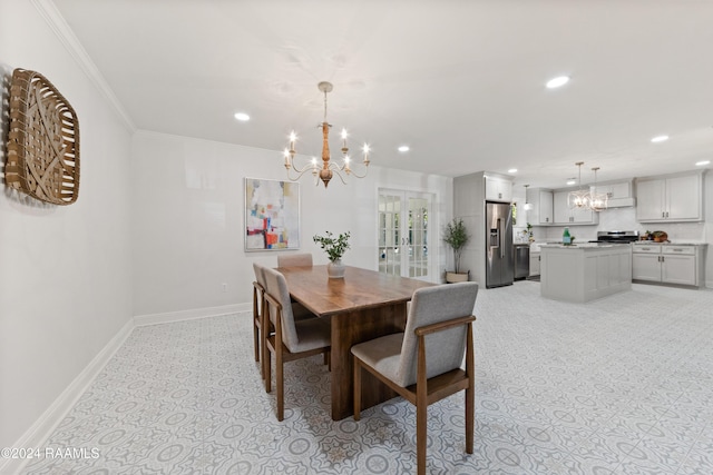 dining room with a chandelier and ornamental molding