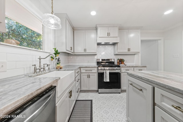 kitchen with white cabinetry, stainless steel appliances, and hanging light fixtures