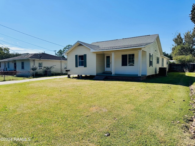 ranch-style home featuring a front yard