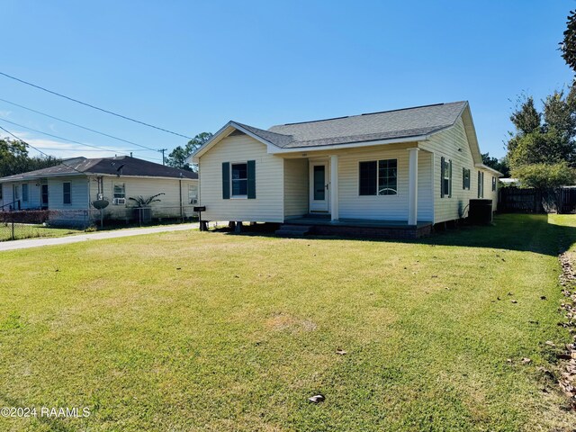 205 Gauraud St, Abbeville, LA 70510 - view of front facade featuring a porch and central AC unit