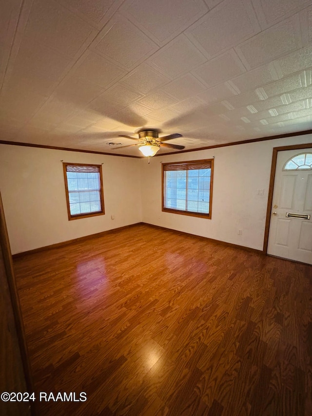 unfurnished room with hardwood / wood-style floors, ceiling fan, and plenty of natural light