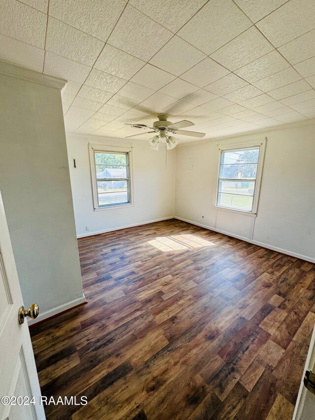 205 Gauraud St, Abbeville, LA 70510 - empty room with wood finished floors, ceiling fan, and baseboards