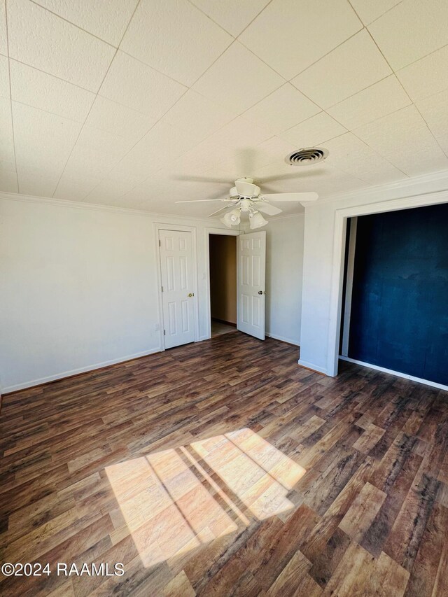 205 Gauraud St, Abbeville, LA 70510 - unfurnished bedroom with wood finished floors and baseboards
