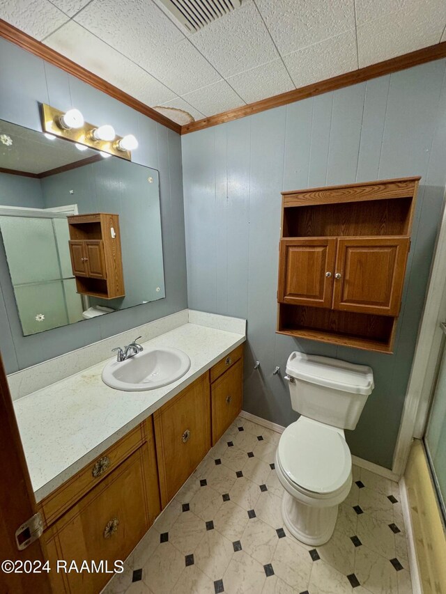 205 Gauraud St, Abbeville, LA 70510 - full bath with crown molding, vanity, toilet, and a shower with shower door