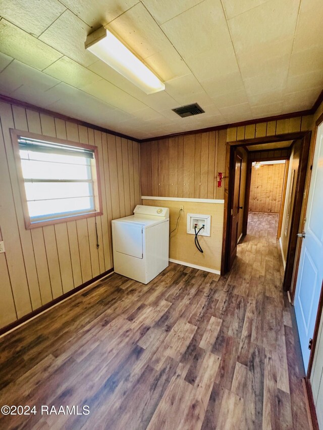 205 Gauraud St, Abbeville, LA 70510 - laundry room featuring washer / clothes dryer, dark wood finished floors, and wooden walls
