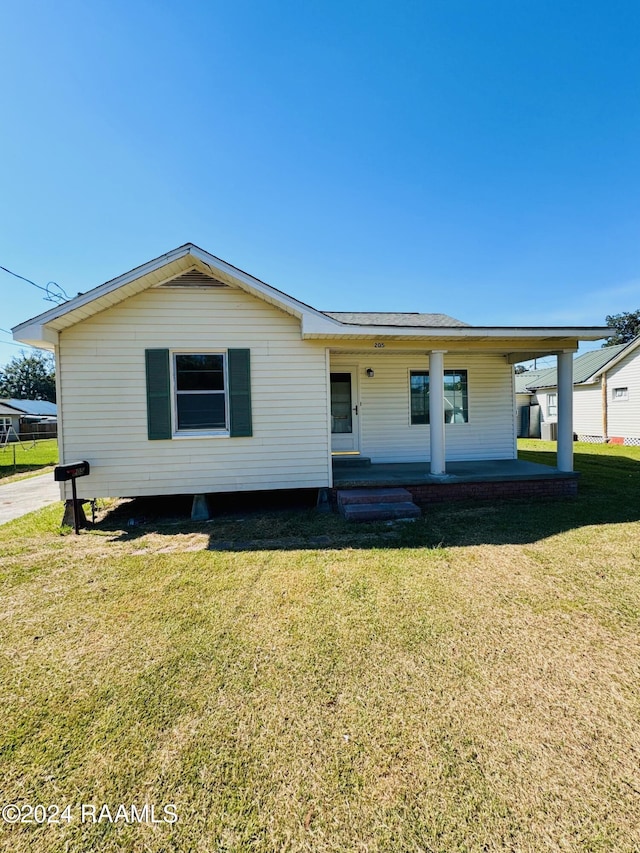 205 Gauraud St, Abbeville, LA 70510 - rear view of house with a porch and a yard
