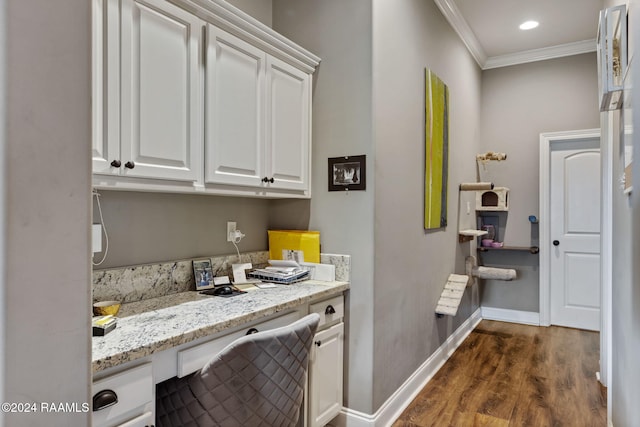 interior space with dark hardwood / wood-style flooring and ornamental molding