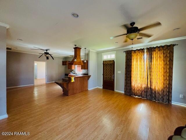 unfurnished living room with ornamental molding, ceiling fan, and light hardwood / wood-style flooring