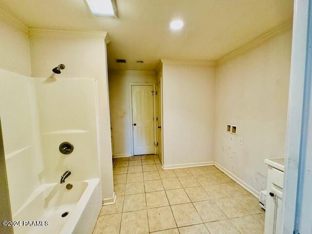 bathroom with vanity, bathtub / shower combination, ornamental molding, and tile patterned flooring