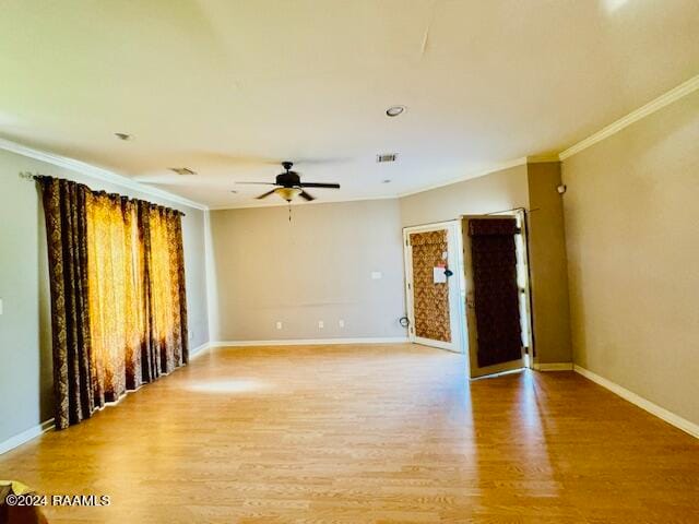 spare room featuring ornamental molding, ceiling fan, and light hardwood / wood-style floors