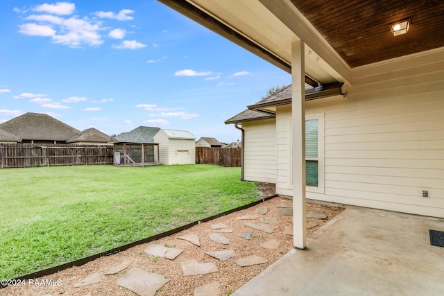 view of yard with a patio area and an outdoor structure