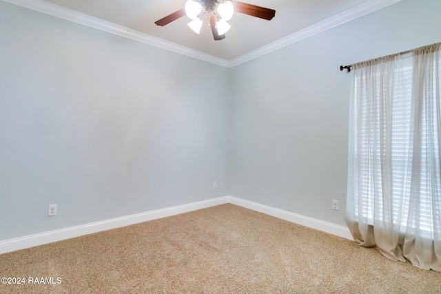 carpeted empty room featuring ceiling fan and ornamental molding