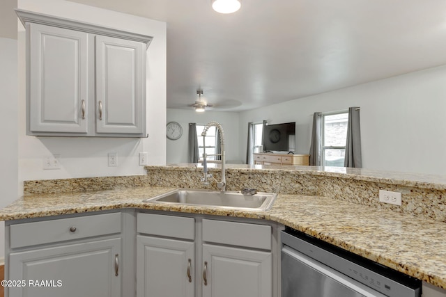 kitchen featuring sink, gray cabinets, dishwasher, kitchen peninsula, and ceiling fan