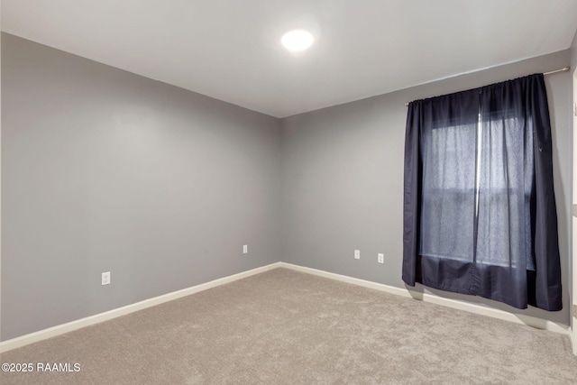 unfurnished room featuring carpet floors