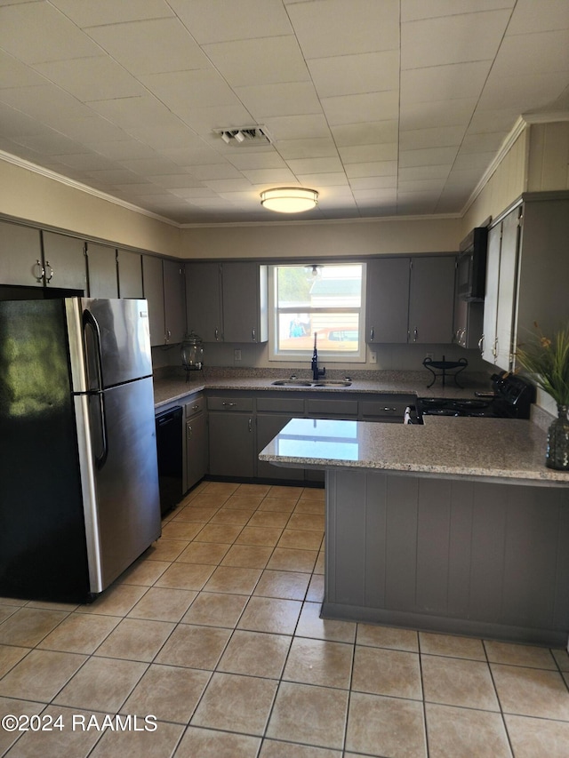 kitchen with crown molding, stainless steel fridge, gray cabinetry, and sink