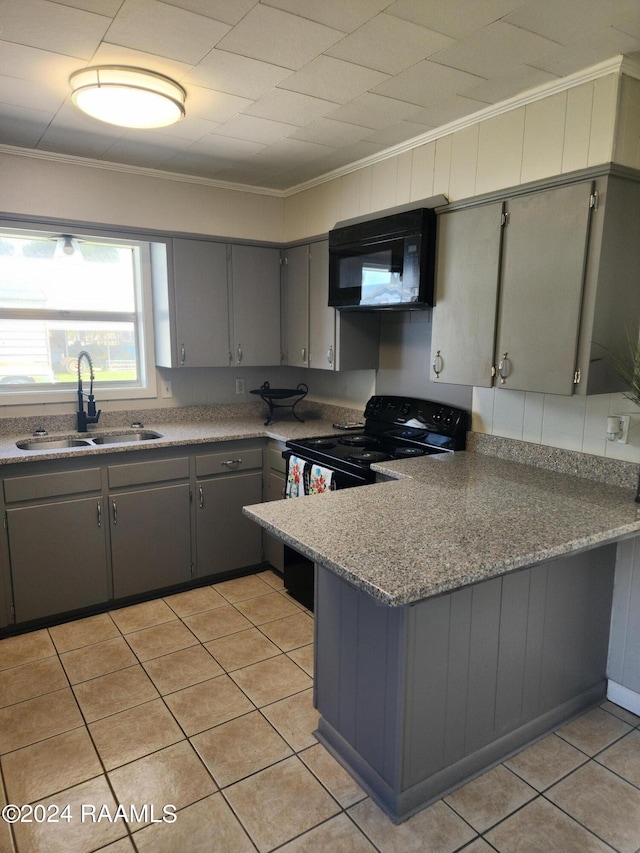 kitchen featuring black range with electric cooktop, crown molding, sink, and gray cabinetry