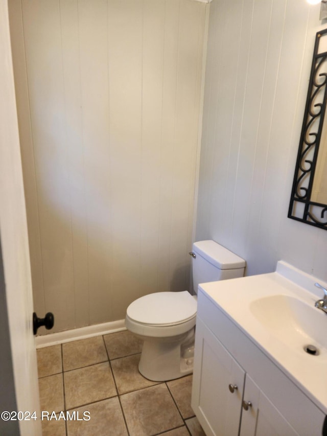 bathroom featuring tile patterned floors, toilet, and vanity