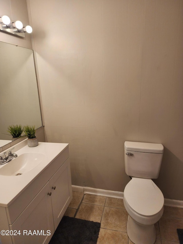 bathroom with tile patterned floors, vanity, and toilet