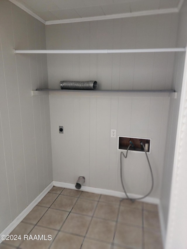 washroom with tile patterned flooring, washer hookup, hookup for an electric dryer, and wooden walls