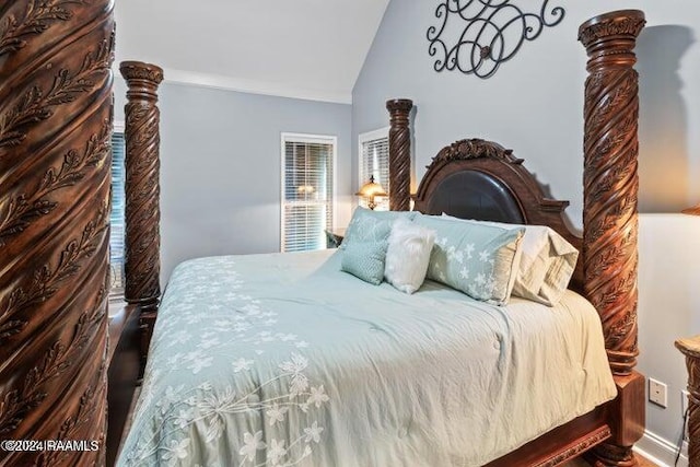 bedroom featuring vaulted ceiling