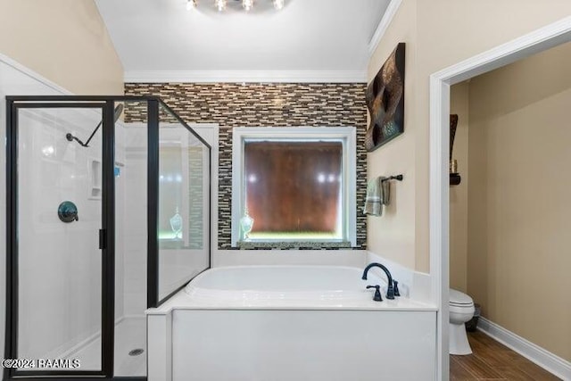 bathroom with independent shower and bath, ornamental molding, hardwood / wood-style flooring, and toilet