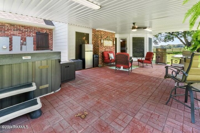 view of patio featuring ceiling fan