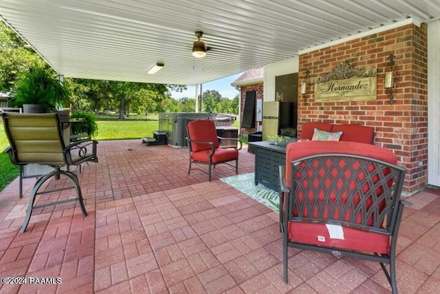 view of patio with a hot tub