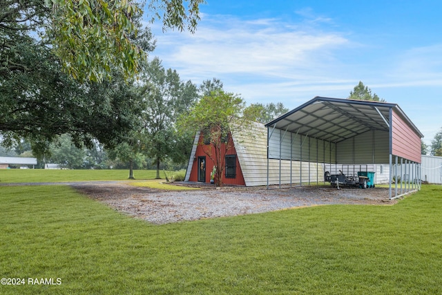 135 Woodys Ln, Sunset, LA 70584 - view of barn featuring a detached carport, a yard, and driveway