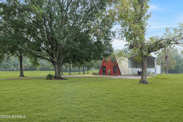 135 Woodys Ln, Sunset, LA 70584 - view of green lawn featuring an outdoor structure and a barn