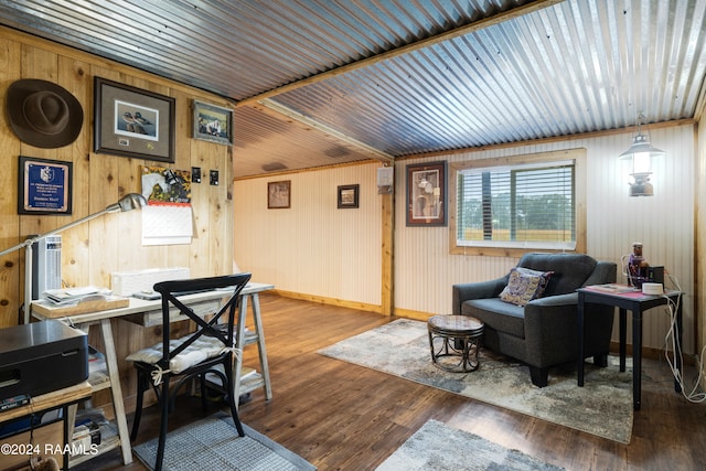 interior space with wooden walls, hardwood / wood-style flooring, and wooden ceiling