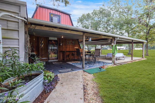 exterior space with a patio area and a yard