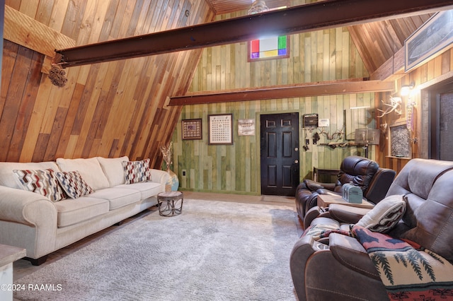 living room with wood walls, beam ceiling, high vaulted ceiling, and carpet