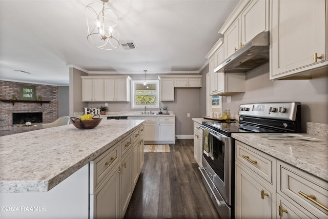 kitchen featuring pendant lighting, ornamental molding, dark wood-type flooring, extractor fan, and double oven range