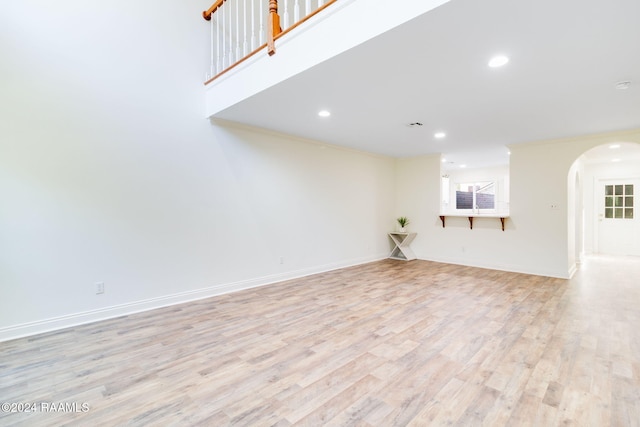 unfurnished living room with light hardwood / wood-style flooring