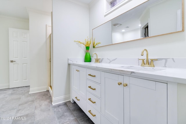 bathroom with vanity and crown molding