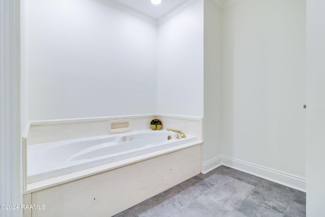 bathroom with a bath and crown molding