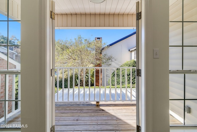 entryway featuring hardwood / wood-style flooring, a healthy amount of sunlight, and wooden ceiling