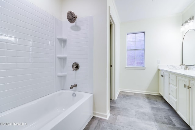 bathroom with vanity and tiled shower / bath