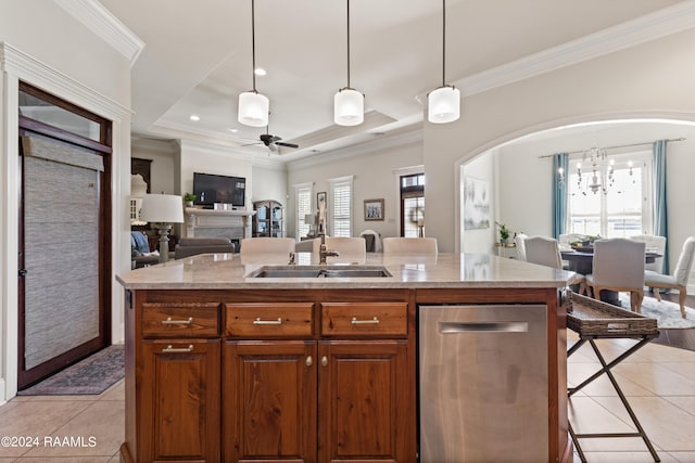 kitchen with plenty of natural light and an island with sink