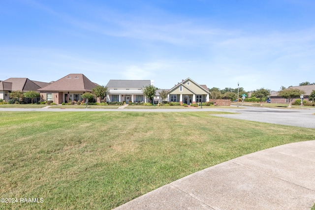 ranch-style home with a front lawn