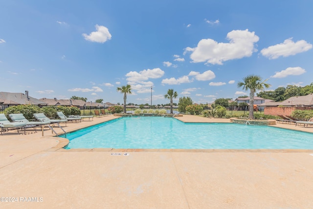 view of pool featuring a patio area and pool water feature