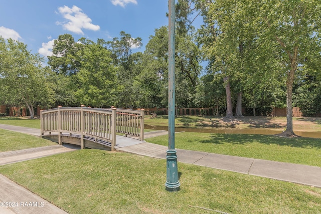 view of property's community with a lawn