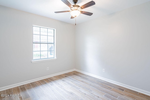 unfurnished room with ceiling fan and light hardwood / wood-style floors