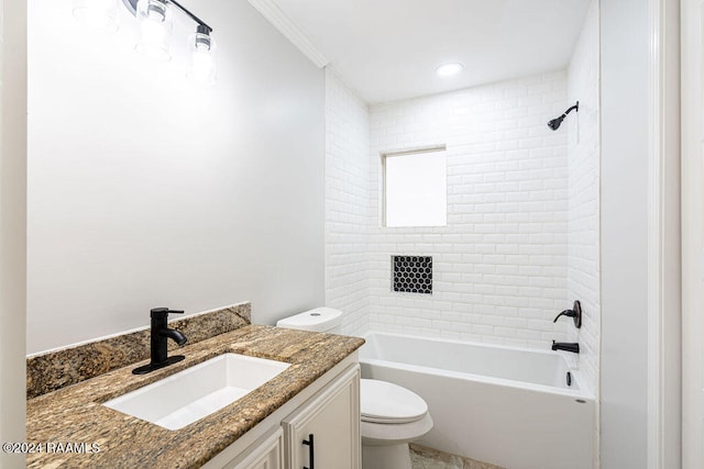 full bathroom featuring vanity, toilet, tiled shower / bath combo, and ornamental molding