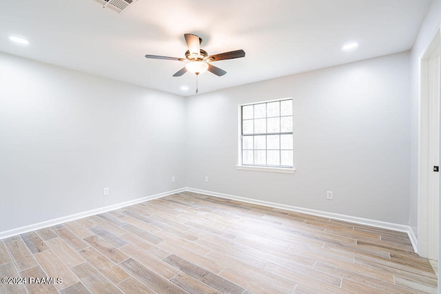 unfurnished room with ceiling fan and light hardwood / wood-style flooring