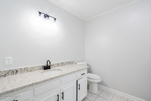 bathroom with vanity, tile patterned floors, toilet, and ornamental molding