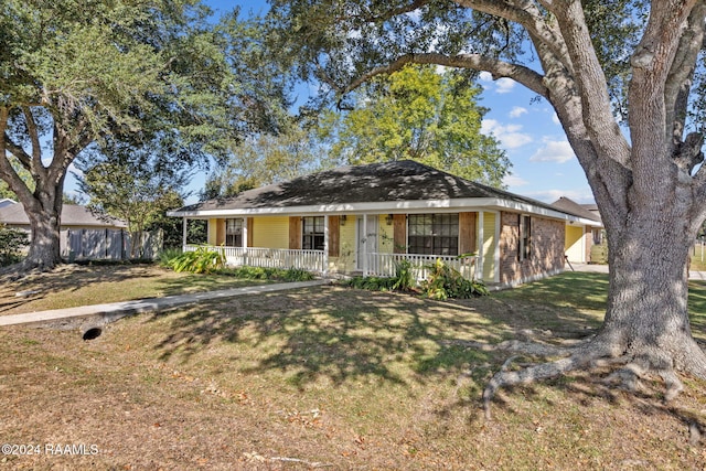 view of front of property with a porch and a front lawn