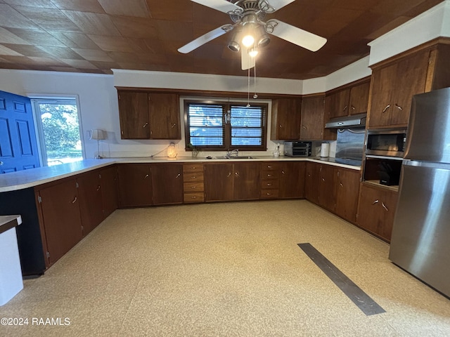 kitchen featuring dark brown cabinets, appliances with stainless steel finishes, sink, and ceiling fan